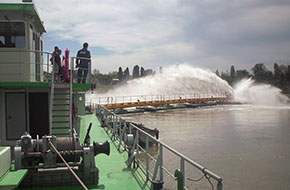 Dustpan motor dredger in operation